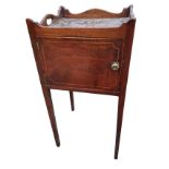 A nineteenth century mahogany bedside cabinet, the tray top with handles to rails above a boxwood
