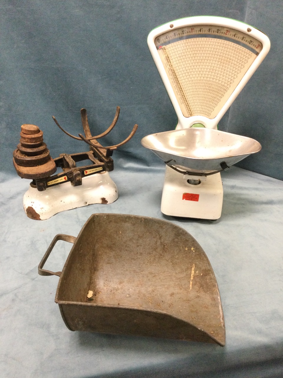 A set Avery cast iron enamelled shop scales with fan shaped dial under glass, with scoop weighing