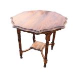 A late Victorian circular scalloped top occasional table raised on ring-turned legs joined by square