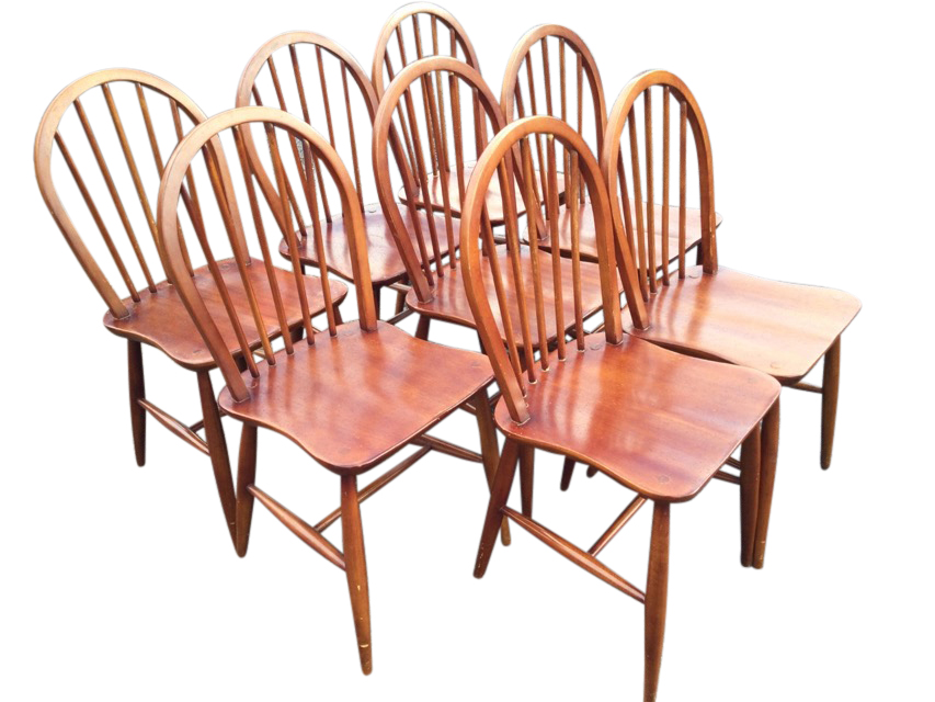 A set of eight 1960s hoop spindleback dining chairs, with shaped saddle seats raised on turned