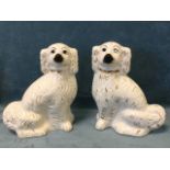 A pair of large late Victorian Staffordshire wally dogs with gilt decoration and collars, having