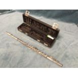 A cased Boosey & Hawkes flute, the cooper pattern instrument in three sections, in lined panelled