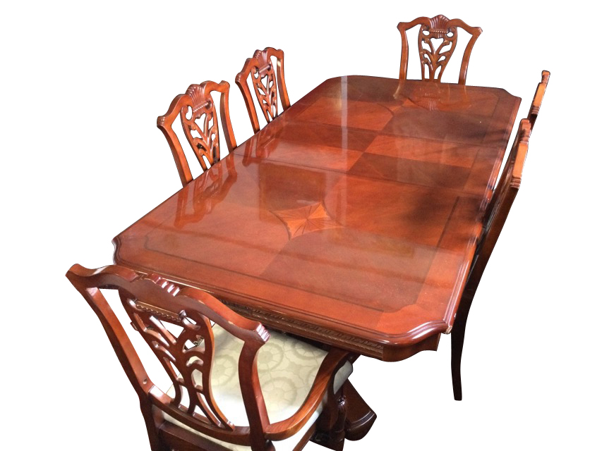 A reproduction mahogany dining suite, the table with crossbanded cut-corner parquetry top above a