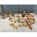 A miscellaneous collection of brass - candlesticks, a shoe horn, bells, horse, ornaments, a