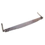 An antique two-handled log saw with crescent shaped 5ft blade and turned hardwood handles. (64in)