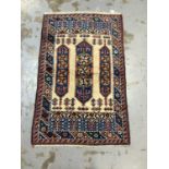 Eastern rug with geometric decoration on red, blue and cream ground, 150cm x 94cm