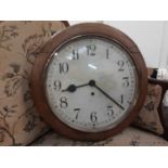 Early 20th century Enfield circular wall clock in oak case, dial is 30cm diameter, bearing label -