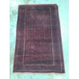 Eastern rug with geometric decoration on red ground, 202cm x 125cm