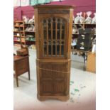 Good quality gothic style oak two height corner cabinet by Frank Pratt of Derby