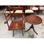 Mahogany occasional table with circular top and an elbow chair