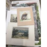 Group of unframed paintings and drawings.