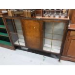 Early 20th century walnut veneered display cabinet, 137cm wide, 31.5cm deep, 107cm high