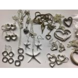 Collection silver and white metal heart pendants on chains, other pendants and pairs of earrings