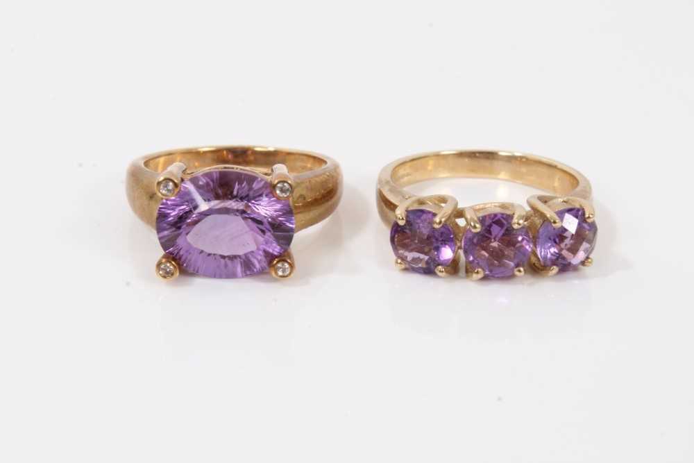 Two 9ct gold purple stone dress rings