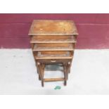 Oriental nest of four occasional tables with carved decoration