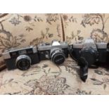 Collection of cameras including Canon FT, Yashica, Minotaur etc, plus accessories and a pair of Tels