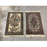 Small Eastern rug with tree, deer and bird decoration, 100cm x 64cm together with another small rug,