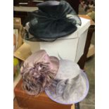 Three ladies occasion hats in Peter Bentley hat box and vintage suitcases