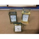Two brass carriage clocks and travelling clock