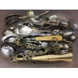 Pair of Georgian silver scissor action sugar nips, German silver (800) spoon and assorted plated cut