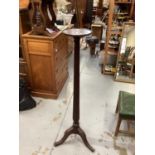 Good quality mahogany torchere with circular top on reeded column on three splayed legs, 147cm high