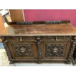 Late Victorian heavily carved oak sideboard