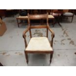 Antique bar back elbow chair with padded seat on turned front legs