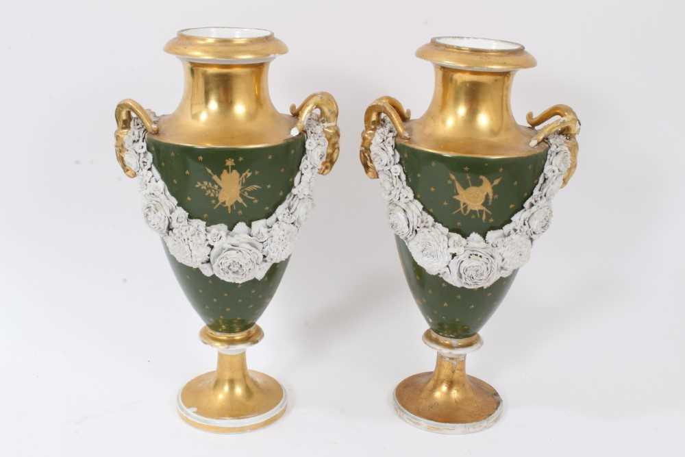 Pair of Paris porcelain vases, 19th century, decorated with swags of encrusted flowers on a green an