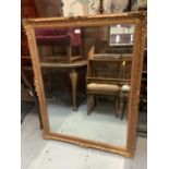 Large bevelled wall mirror in gilt effect frame, 94cm x 121cm