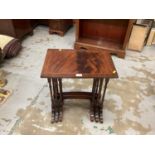 Nest of three Regency style mahogany side tables, plus two other side tables