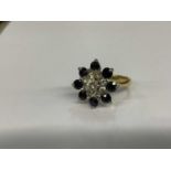 Diamond and sapphire cluster ring in 18ct gold setting