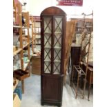 Late 19th century narrow mahogany corner cupboard with shelves above enclosed by two astragal glazed