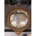 Nineteenth century convex wall mirror in circular gilt frame with ball decoration, 77cm high, 55cm w