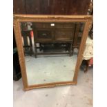 Large bevelled wall mirror in gilt effect frame, 94cm x 121cm