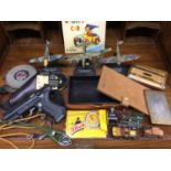 Three Battle of Britain model aircrafts, toy cars and trains, cigarette cases, wallets, sling shot,