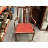 Edwardian inlaid mahogany elbow chair with padded seat on square taper front legs