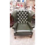 Leather upholstered wing armchair