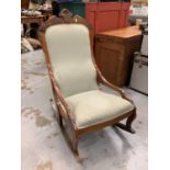 A Victorian green upholstered bedroom rocking chair