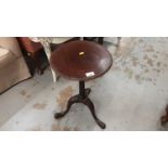 Georgian style mahogany wine table with circular top on fluted turned column and three splayed legs