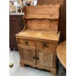 Old pine chiffonier with raised shelf back, two drawers and two panelled doors below, 81cm wide, 42.