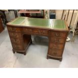 Good quality Georgian style mahogany kneehole desk with inset leather lined top and nine drawers bel