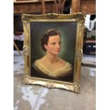 Oil on canvas quarter length portrait of a lady