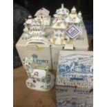 Seven various Coalport cottages, some boxed