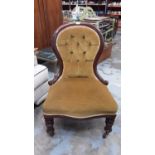 Victorian mahogany framed nursing chair with buttoned upholstery on turned front legs and castors, 5
