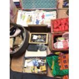 Sewing boxes containing vintage dress patterns, buttons, sewing accessories and a beaded bag