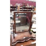 Victorian mahogany toilet mirror on shaped plateau base and scroll feet, 56.5cm wide, 26.5cm deep, 6