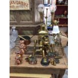 Good collection of copper and brassware, including graduated jugs, oil lamps, etc