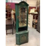 Unusual green painted shop's corner cabinet, with gilt advertisement and glass back