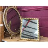 Oval wall mirror with gilt plaster frame and dressing table mirror