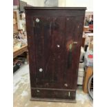 Old stained pine cupboard with interior shelves enclosed by single door, with drawer below, 88.5cm w